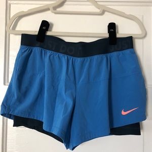 Blue Nike Dri-Fit shorts